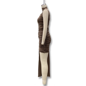 Detail view of brown sleeveless dress featuring ruched fabric and high side slit design