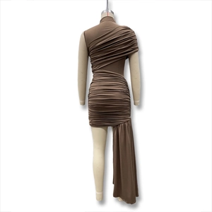 Detail of ruched brown sleeveless dress with asymmetric neckline and draping fabric fringe