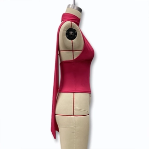 Detail view of fuchsia halter top showing elegant neck ties and smooth fabric texture