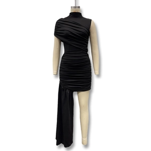 Detailed view of the black ruched sleeveless dress with unique asymmetric trailing hem side