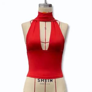 Close-up of vibrant red halter neck top with deep V-cut and elastic knitted fabric