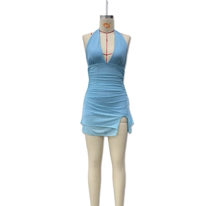 Detail of light blue halter neck dress with ruched fabric and a sexy side slit detail
