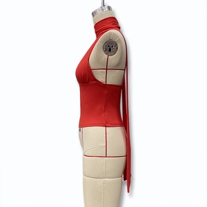 Detail of red halter neck top showing the sexy backless design and slim fit cut
