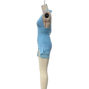 Detail of light blue ruched halter dress with side slit design and bodycon fit