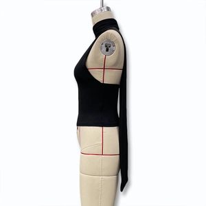 Side view of black halter neck backless top with long flowing ribbons on a mannequin