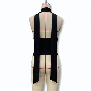 Detailed back view of a black halter top featuring long elegant draping neck ties