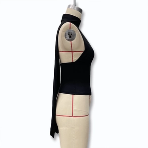 Side view of backless mock neck top with long flowing ribbons on professional mannequin