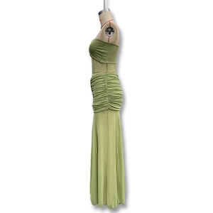 Detail of ruched waist and side profile on bean green tube top and maxi skirt set