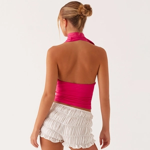 Detail view of the halter neck tie and sexy backless design on a rose pink summer top