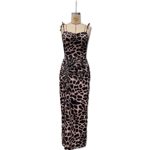 Detail of leopard print maxi dress showing side drawstring ruching and slit design