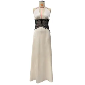 Detail of the champagne satin evening dress with intricate black lace waist paneling