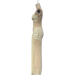 Detail view of cream white two-piece mesh dress with side drawstring and fishtail hem
