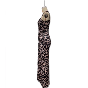 Detail of leopard print maxi dress showing ruched side seams and high-slit slimming fit