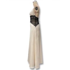 Detail view of champagne satin dress featuring black eyelash lace waist and side profile