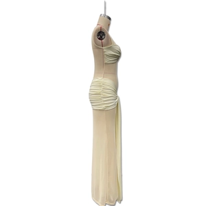 Detailed side view of cream ruched two-piece set featuring maxi skirt with long streamers