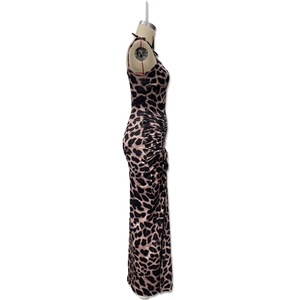 Detailed side view of leopard print maxi dress with drawstring ruched side and sleek fabric
