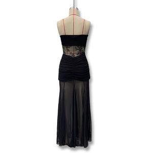 Detail view of sexy black sleeveless maxi dress with floral lace waist and ruched mesh skirt