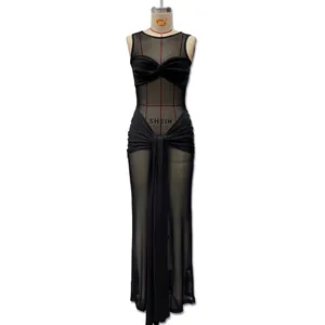 Detail of black mesh dress featuring sleeveless crew neck and crossed waist sashes
