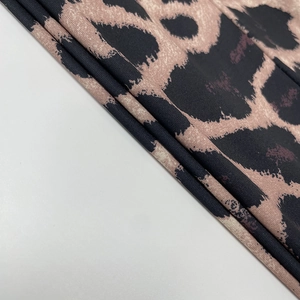 Close-up detail of leopard print fabric texture on a slim fit ruched summer dress