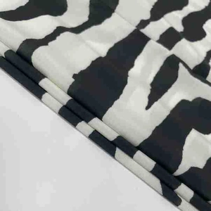 Detailed macro view of zebra print chiffon fabric with high-quality textile texture
