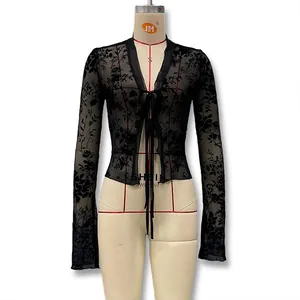 Detail of sheer black floral mesh cardigan with front tie closure and elegant V-neckline