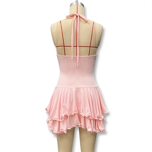Detail view of pink halter dress back featuring layered ruffle hem and slim fit design