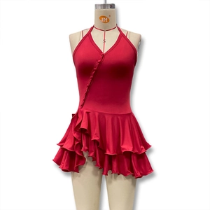 Detail of red halter dress featuring ruffled layers and buttoned front design