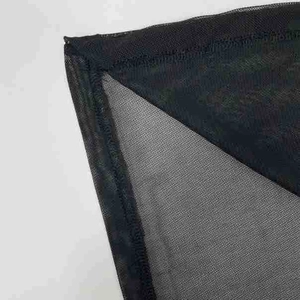 Close-up detail of sheer black mesh fabric with reinforced hem stitching on a dress