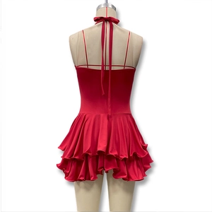 Detail of red halter backless dress with ruffled hem and slim fit design for summer
