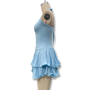 Detail of light blue halter neck dress featuring slim waist and layered ruffle hemline