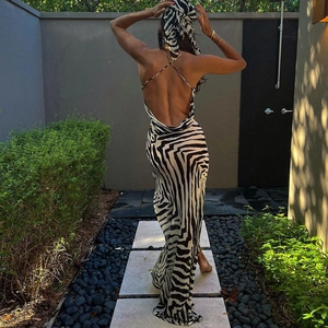 Detail of zebra print backless maxi dress with criss-cross straps and matching headscarf