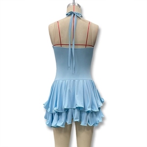 Detail of the sky blue halter dress showing the backless design and layered ruffles