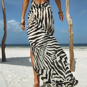 Close-up of zebra print maxi dress featuring high slit and lightweight chiffon fabric