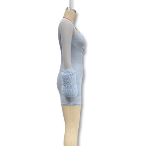 Detail view of voluminous pleated mesh ruffles on light blue slim fit dress sleeves