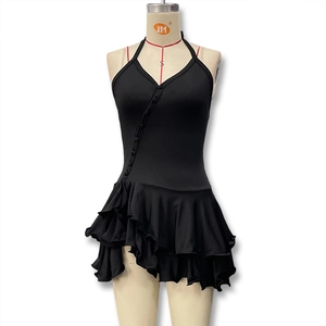Detailed view of the ruffle hem and single-breasted buttons on this slim fit halter dress