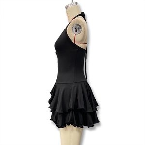 Detail of the slim fit halter neck dress showing side view and layered ruffle hem