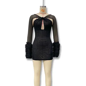 Close-up of black mesh dress featuring cutout neckline and ruffled tulle sleeve details