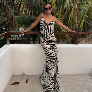 Close-up of zebra print maxi dress with cowl neck and elegant draping detail