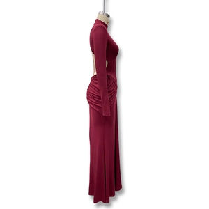 Detailed side view of wine red backless dress showing ruched fabric and cut-out design