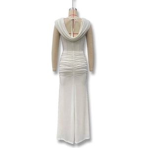 Close-up of elegant white ruched dress with deep draped back and tie-bow detail