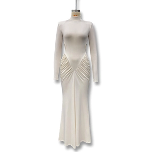 Detailed side cutout and elegant ruching on a beige high-neck long sleeve maxi dress