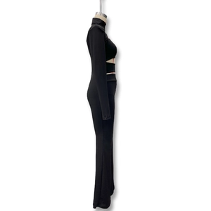 Detail view of black slim fit bodysuit with hollow cut-out design and high neck long sleeves