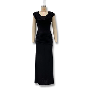 Detail of elegant black slim fit dress with draped cowl neck and waist pleats texture