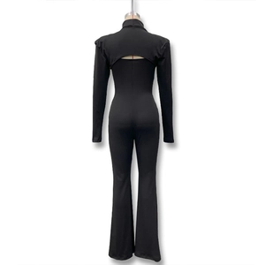 Detail view of black mock neck long sleeve top and slim fit flared jumpsuit set