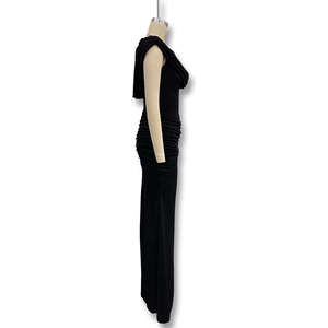Detail view of elegant black ruched side seams on a slim fit cowl neck dress
