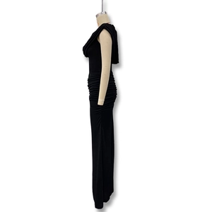 Detail view of black bodycon dress featuring side ruching and sleeveless slim fit design