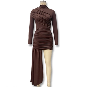Detail of dark brown long sleeve ruched dress with asymmetrical draped hemline
