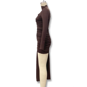 Detail view of brown ruched long sleeve dress with irregular hem and side drapes