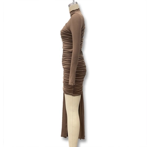 Detail of dark brown ruched fabric and mock neck design on a slim fit long sleeve dress
