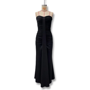 Detail view of black bodycon evening dress featuring horizontal ruching and vertical draping